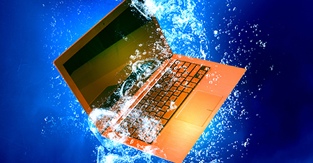 Laptop submerged in water
