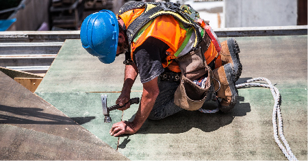 man working on roof