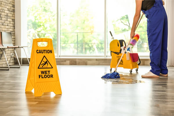 Clean Sweep technician mopping. Westminster, MD Office Cleaning