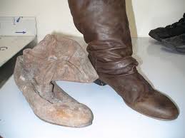 soot covered leather boots