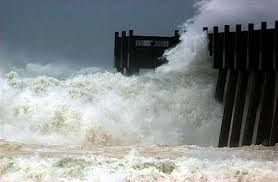 hurricane wave striking a pier