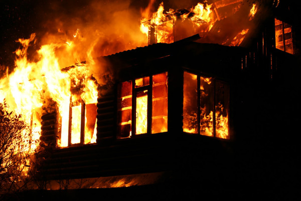 Windows of the burning house — Stock Photo