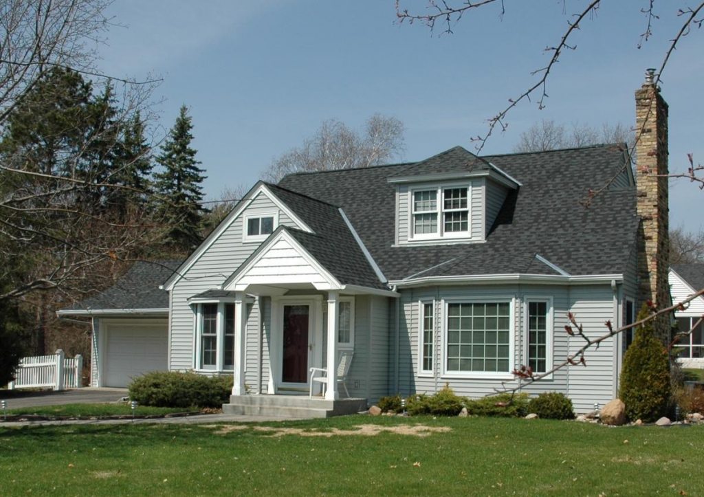 Exterior of a small two-story cottage style home.