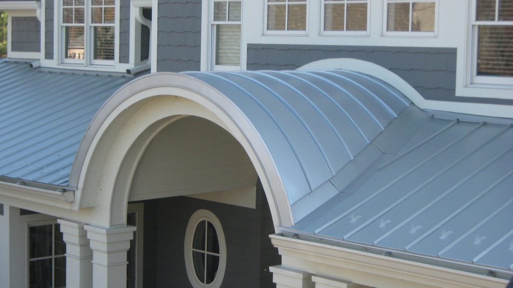 Close-up of grey standing seam metal roof over a porch