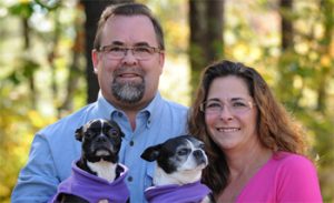 Head shot of Pat & Julie Quarve with their dogs