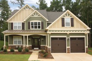 Exterior of two-story home with Hardie siding in earth tones